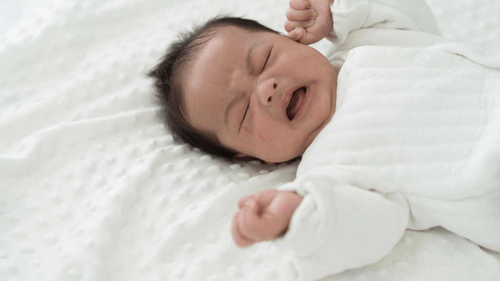 baby crying in white
